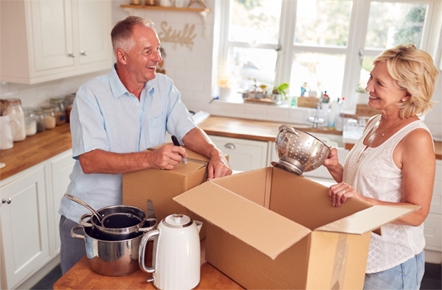 Organized moving boxes in a calm home transition setting