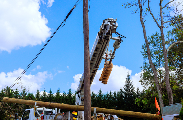 Hydro poles and overhead power lines along a rural property